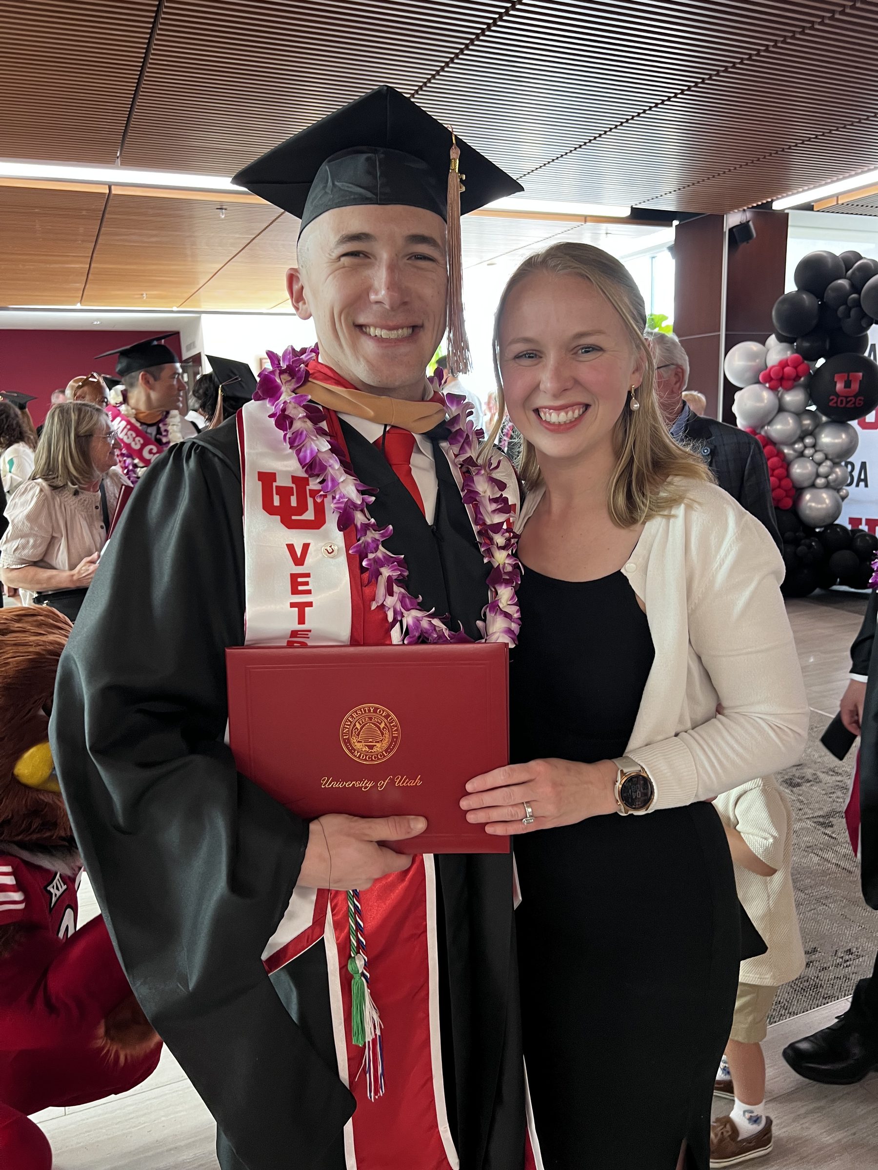Adam at his University of Utah EMBA graduation with Erin