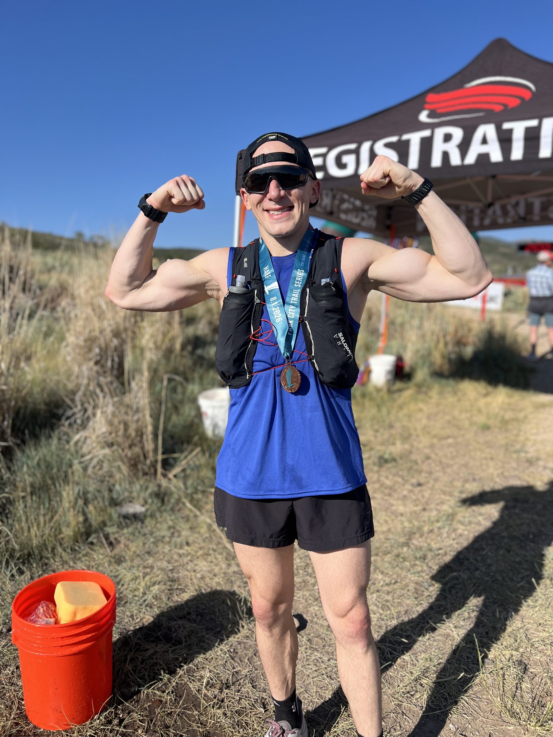 Adam flexing after the Park City Trail Series half marathon